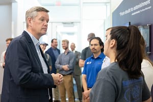 Christopher Hanson, NRC chair, visits with ACU students and NEXT Lab employees.