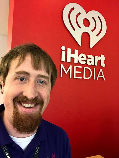 Dr. James Prather with iHeart Media logo.