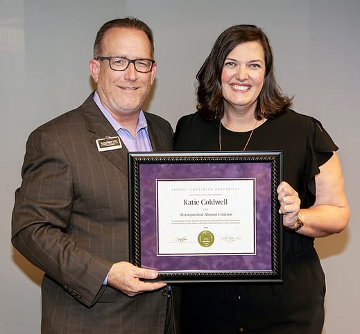 Craig Fisher ('92), assistant vice president for alumni and university relations, poses with Katie Coldwell ('00) at her 2019 Distinguished Alumni Citation ceremony Aug. 8 at ACU Dallas. 