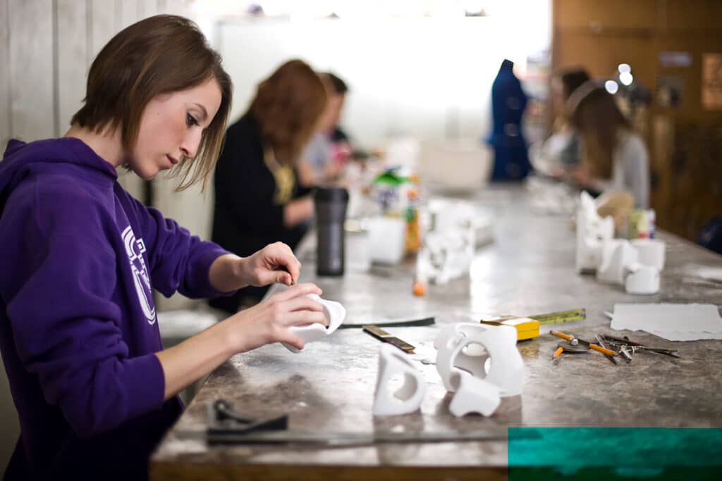 a student of the College of Arts and Sciences making her artwork