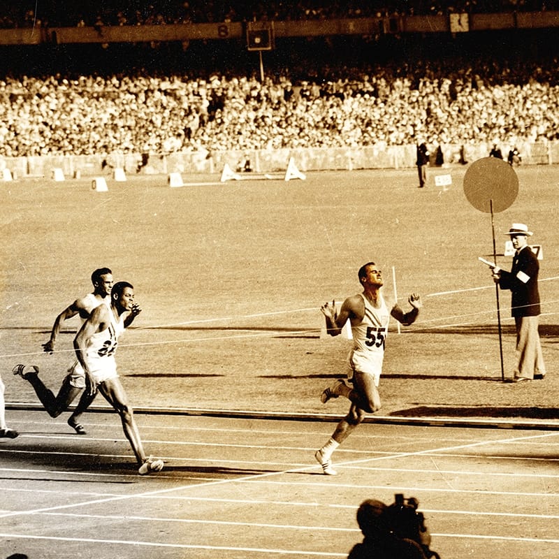 Morrow crosses the finish line in Melbourne, Australia, in 1956, where he won three gold medals and became a national hero.